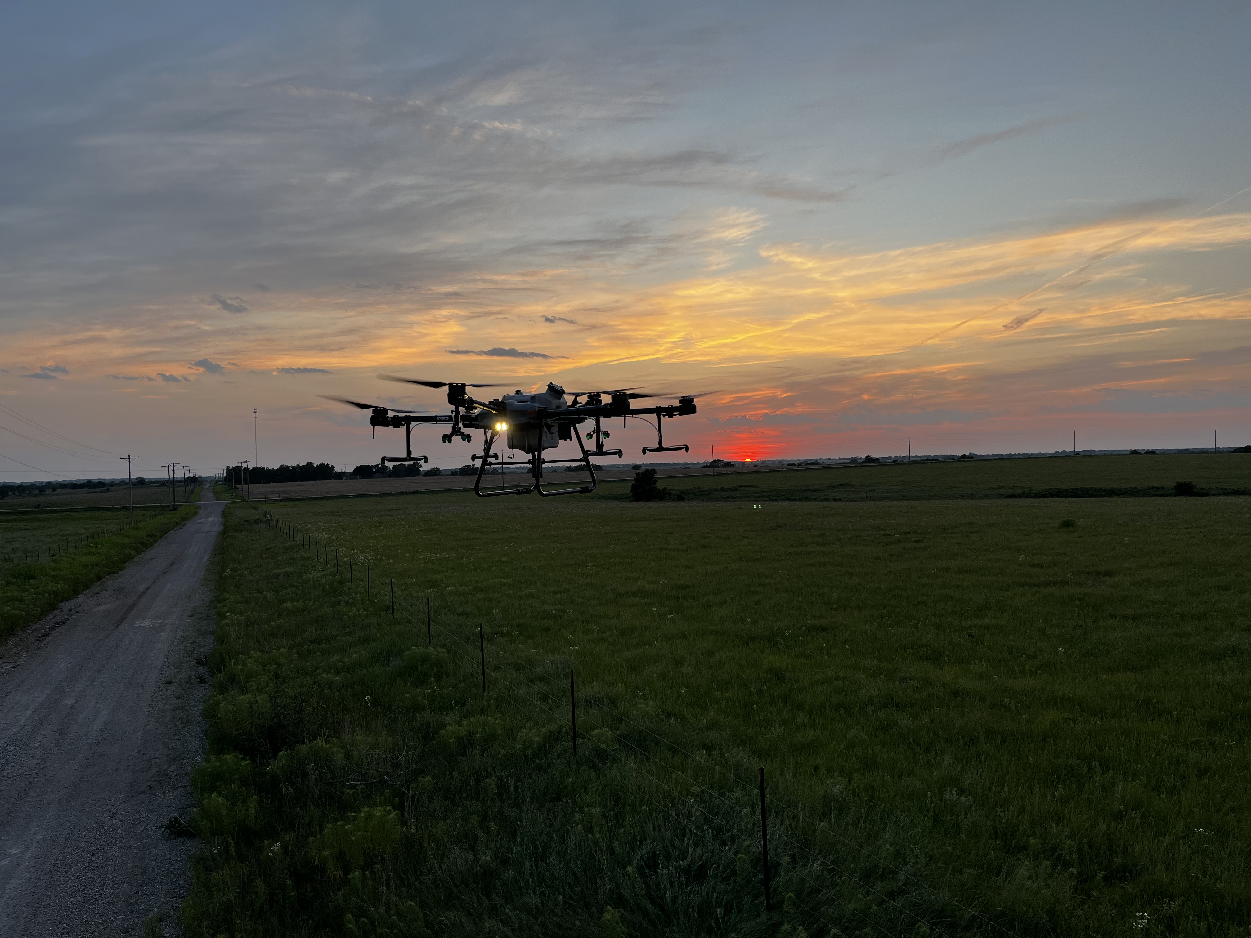 Drone operating at sunset